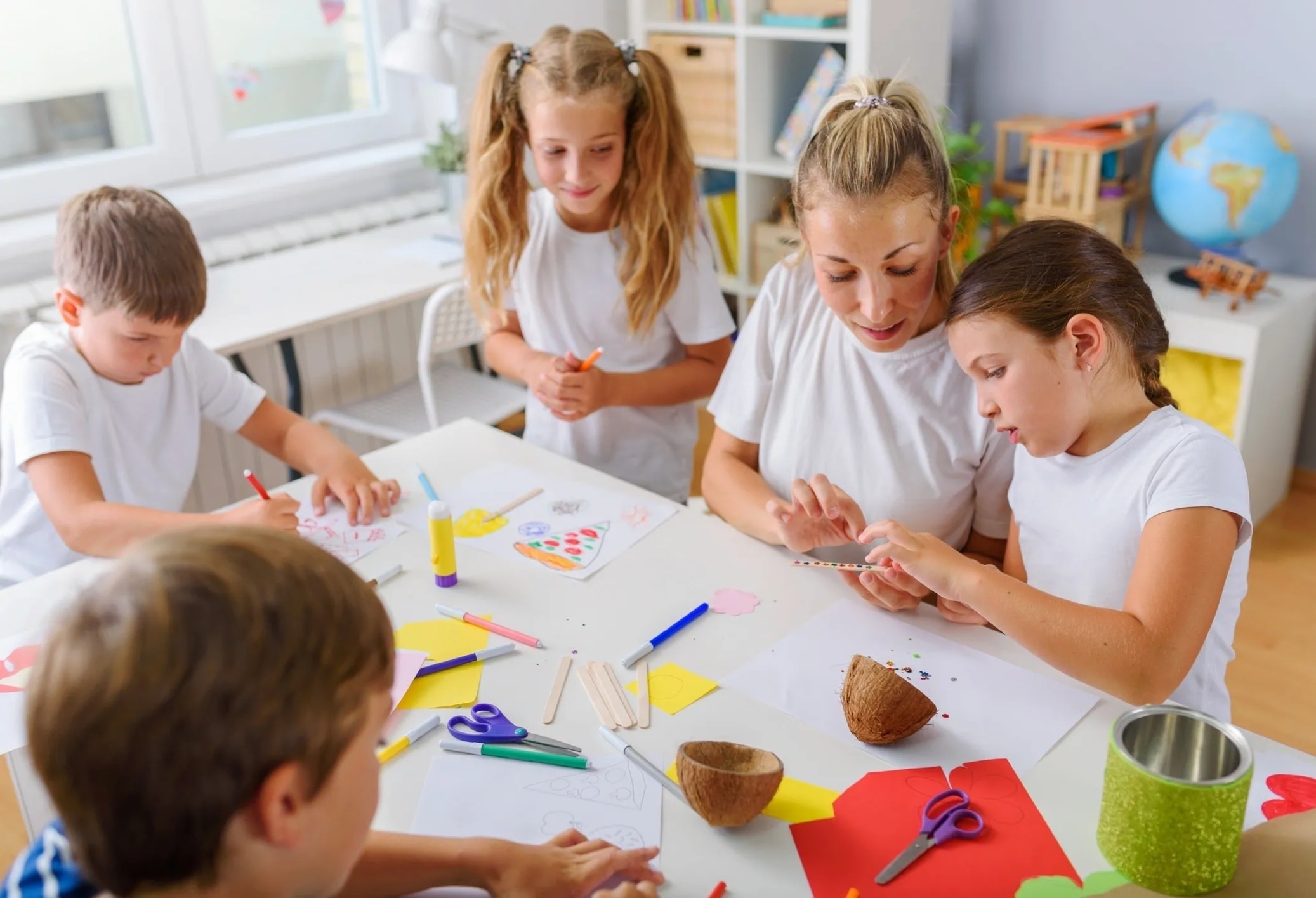 Children engaged in a creative craft activity in a classroom